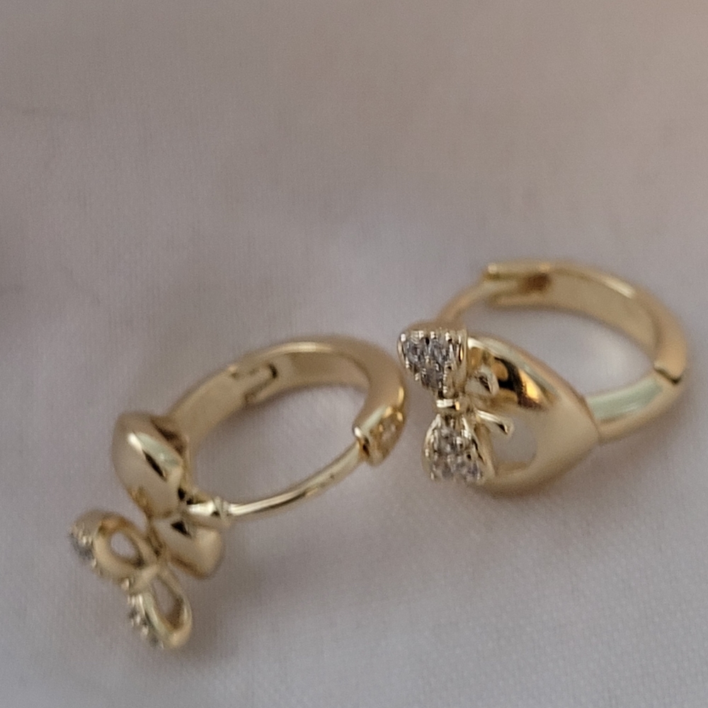 Gold tone earrings for pieced ears.